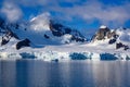 Snowcapped mountains and glacier in beautiful landscape on sunny day, Lemaire Channel near Paradise Bay, Antarctica Royalty Free Stock Photo
