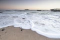 Beautiful morning on the sandy beach. Long exposure at the sea. Milky sunrise in haze and fog. Corralejo, Canary Islands, Spain