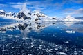 Antarctic landscape, snow on mountains reflecting in blue water, ice flows, Lemaire Channel near Paradise Bay, Antarctica Royalty Free Stock Photo