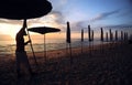 Beautiful morning sunrise with beach parasol Royalty Free Stock Photo