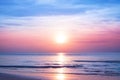 Beautiful morning sunrise, blue sea, pink sky, white clouds, yellow sun glow, golden reflection on water, peaceful landscape