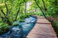 Beautiful morning view of Plitvice National Park. Sunny spring scene of green forest with pure water lake. Marvelous countryside l Royalty Free Stock Photo