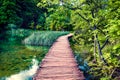 Beautiful morning view of Plitvice National Park. Sunny spring scene of green forest with pure water lake. Marvelous countryside l Royalty Free Stock Photo