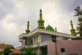 Beautiful mosque with green and yellow dome photo taken in Jakarta Indonesia