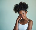 Beautiful in the most natural way. Studio shot of a beautiful, fresh faced young woman posing against a green background