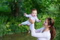 Beautiful mother with a baby girl in summer park Royalty Free Stock Photo