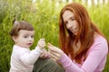 Beautiful mother and baby little girl outdoor Royalty Free Stock Photo