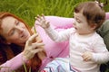 Beautiful mother and baby little girl outdoor Royalty Free Stock Photo