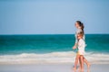 Beautiful mother and daughter at Caribbean beach enjoying summer vacation. Royalty Free Stock Photo