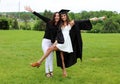 Beautiful mother and daughter in black Cap, Gown and Tass, teenager. Unique gorgeous face, nice smile, wonderful eyes girl.