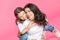 Beautiful mother and daughter hugging and smiling at camera Royalty Free Stock Photo