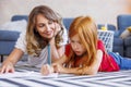 Mother tutoring daughter at home