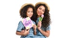 beautiful mother and daughter with mothers day greeting card and flower Royalty Free Stock Photo