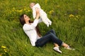 Beautiful mother having fun with her little cute baby in summer garden Royalty Free Stock Photo