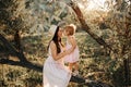 Beautiful Mother And her little daughter outdoors. Nature. Beauty Mum and her Child playing in Park together. Outdoor Royalty Free Stock Photo