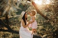 Beautiful Mother And her little daughter outdoors. Nature. Beauty Mum and her Child playing in Park together. Outdoor Royalty Free Stock Photo