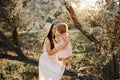 Beautiful Mother And her little daughter outdoors. Nature. Beauty Mum and her Child playing in Park together. Outdoor Royalty Free Stock Photo