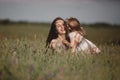 Beautiful Mother And her little daughter outdoors. Nature. Outdoor Portrait of happy family. Happy Mother`s Day Joy Royalty Free Stock Photo