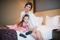 Beautiful mother hugs daughter in the bedroom Royalty Free Stock Photo