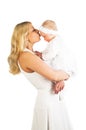 Beautiful mother kissing baby girl Royalty Free Stock Photo