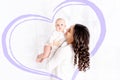 Beautiful mother kissing newborn baby holding in his arms a home, the concept of happy loving family, lifestyle Royalty Free Stock Photo