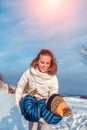 Beautiful mother plays with her child, a boy of 4 years. In the winter in the fresh air. Background of snow and drifts Royalty Free Stock Photo