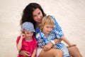 Beautiful mother and two kids enjoying beach vacation. Royalty Free Stock Photo