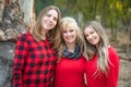 Blonde Mother and Young Adult Daughters Portrait Outdoors