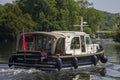 A beautiful motor cruiser cruising on the Thames at Henley-on-Thames in Oxfordshire