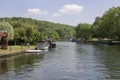 Beautiful motor cruisers and barges berthedon the Thames at Henley-on-Thames in Oxfordshire