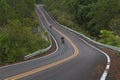 Beautiful mountain asphalt road with curve and double yellow lin