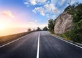 Beautiful mountain asphalt road with rocks, blue sky at sunset Royalty Free Stock Photo