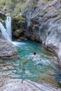 A beautiful mountain gorge with a river and a waterfall