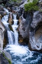 A beautiful mountain gorge with a river and a waterfall