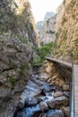 A beautiful mountain gorge with a river and a waterfall