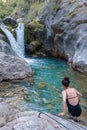 A beautiful mountain gorge with a river and a waterfall