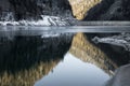 Beautiful mountain lake of artouste in sunrise dawn reflecting mountains, pyrenees, france Royalty Free Stock Photo