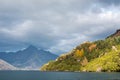 Beautiful mountain lake on a cloudy day. Landscape of a large lake in Queenstown, New Zealand. Royalty Free Stock Photo