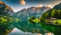 A beautiful mountain lake with a house in the background Royalty Free Stock Photo