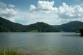 Beautiful mountain lake landscape, cloudy blue sky and green grass field, Malaysia Royalty Free Stock Photo