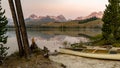 Canoe parked on the shore of an Idaho mountain lake at sunrise Royalty Free Stock Photo