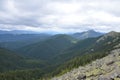 Forest and huge stones on top of the hillside near the peak of mountain range. Carpathians, Ukraine Royalty Free Stock Photo