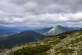 Amazing forest and huge stones on top of the hillside near the peak of mountain. Carpathians, Ukraine Royalty Free Stock Photo