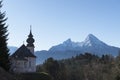 Beautiful mountain landscape in the Bavarian Alps with pilgrimage church of Maria Gern and Watzmann massif in the background Royalty Free Stock Photo