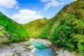 Beautiful mountain landscape with blue cloudy sky and Hozu River seen from Sagano Scenic Railway or romantic train in Arashiyama, Royalty Free Stock Photo