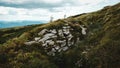 Beautiful mountain landscape of Carpathians, green mountains and rocks on background of clouds Royalty Free Stock Photo