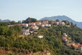 Beautiful mountain landscape with houses with red roofs on mountainside. Montenegro, Herceg Novi