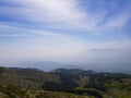 Beautiful mountain landscape, low hills and mountain sillhouette