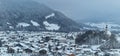 A beautiful mountain landscape with many houses is covered with snow Royalty Free Stock Photo