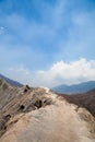 Beautiful mountain landscape. Part of the crater of the Bromo volcano. View from the top of the mountain. Blue sky and frozen lava Royalty Free Stock Photo